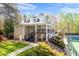 Back exterior of the home featuring multiple decks, stairs and a tennis court at 815 Lake Forest Pass, Roswell, GA 30076