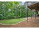 Beautiful backyard featuring lush trees, privacy fence, and multiple decks at 815 Lake Forest Pass, Roswell, GA 30076