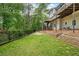 Spacious, fenced backyard with terraced landscaping and multiple decks at 815 Lake Forest Pass, Roswell, GA 30076