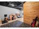 View of the unfinished basement with painted walls, exposed ceiling, and wood accent wall at 815 Lake Forest Pass, Roswell, GA 30076