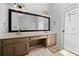 Spacious bathroom featuring double sinks, a large mirror, and updated fixtures at 815 Lake Forest Pass, Roswell, GA 30076