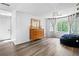 A bedroom featuring a dresser, large windows, and a dark blue beanbag chair at 815 Lake Forest Pass, Roswell, GA 30076