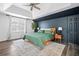 A stylish bedroom featuring a modern color-blocked wall, plush rug, and a cozy king-size bed at 815 Lake Forest Pass, Roswell, GA 30076