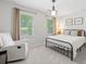 Cozy bedroom with carpet, natural light, and a comfortable chair at 815 Lake Forest Pass, Roswell, GA 30076