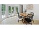 Bright breakfast nook with natural light, tile floor, table, chairs and door to deck at 815 Lake Forest Pass, Roswell, GA 30076