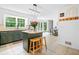 Kitchen with an island, bar stools, granite countertops, and stainless steel appliances at 815 Lake Forest Pass, Roswell, GA 30076
