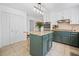 Eat-in kitchen with a center island, stone countertops, stainless steel appliances, and a tile floor at 815 Lake Forest Pass, Roswell, GA 30076