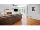 Spacious living room with hardwood floors, fireplace, and access to the deck at 815 Lake Forest Pass, Roswell, GA 30076