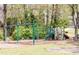 The community playground with climbing structure, swings and slide at 815 Lake Forest Pass, Roswell, GA 30076