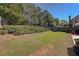 Large backyard with a fence, landscaping, and plenty of room for recreation and outdoor activities at 103 Harvest Rdg, Acworth, GA 30102