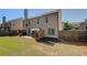Spacious backyard with a patio area and well-maintained lawn, perfect for outdoor entertaining at 103 Harvest Rdg, Acworth, GA 30102