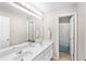 Bathroom with double sinks, a large mirror, and a separate toilet and shower at 103 Harvest Rdg, Acworth, GA 30102