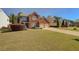 Charming two-story brick home with a well-manicured lawn and two-car garage at 103 Harvest Rdg, Acworth, GA 30102