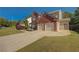 Beautiful home featuring a spacious driveway and an attached two-car garage at 103 Harvest Rdg, Acworth, GA 30102