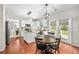 Bright eat-in kitchen with wood floors, granite counters, and stainless appliances at 103 Harvest Rdg, Acworth, GA 30102