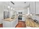 Beautiful kitchen featuring granite countertops, wood floors, and stainless steel appliances at 103 Harvest Rdg, Acworth, GA 30102