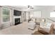 Cozy living room with fireplace, plush seating, and lots of natural light at 103 Harvest Rdg, Acworth, GA 30102