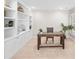 This office features custom built-in shelving and a stylish desk, creating an ideal workspace with natural light at 103 Harvest Rdg, Acworth, GA 30102