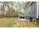 Spacious backyard featuring a deck with seating and mature trees at 130 Brandon Mill Cir, Fayetteville, GA 30214
