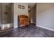 Hallway featuring elegant antique cabinet, chandelier, and eye-catching gray floor at 130 Brandon Mill Cir, Fayetteville, GA 30214