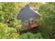 Aerial view of the home surrounded by mature trees at 2114 Lindley Nw Ln, Kennesaw, GA 30144