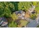 Aerial view of the home's lush yard, landscaping, and driveway at 2114 Lindley Nw Ln, Kennesaw, GA 30144