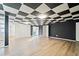 Spacious basement with a unique ceiling design and vinyl floors, perfect for recreation or storage at 2114 Lindley Nw Ln, Kennesaw, GA 30144