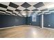 Large basement featuring neutral vinyl floors and a checkered ceiling at 2114 Lindley Nw Ln, Kennesaw, GA 30144