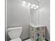 Quirky bathroom with a hand-painted vanity and updated fixtures at 2114 Lindley Nw Ln, Kennesaw, GA 30144