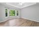 Spacious main bedroom features hardwood floors, trey ceiling, and big windows with beautiful views at 2114 Lindley Nw Ln, Kennesaw, GA 30144