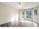 Spacious bedroom featuring hardwood floors, large windows, and neutral paint, creating a relaxing atmosphere at 2114 Lindley Nw Ln, Kennesaw, GA 30144
