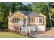Inviting two-story home featuring a brick foundation, white stairs, and a charming facade at 2114 Lindley Nw Ln, Kennesaw, GA 30144