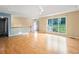 Spacious living room boasting beautiful hardwood floors and natural light from large windows at 2114 Lindley Nw Ln, Kennesaw, GA 30144