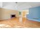 Bright and airy living space with hardwood floors, brick fireplace, and easy access to the kitchen at 2114 Lindley Nw Ln, Kennesaw, GA 30144