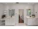 Bright white bathroom featuring double vanity sinks and a separate shower at 300 Massengale Rd, Brooks, GA 30205