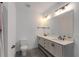 Bright bathroom featuring double vanity, granite countertops, and modern lighting at 300 Massengale Rd, Brooks, GA 30205
