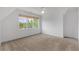 Bedroom with carpet, ceiling fan, and scenic outdoor views at 300 Massengale Rd, Brooks, GA 30205