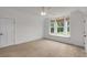 Bright bedroom with carpet, window seating, and natural light at 300 Massengale Rd, Brooks, GA 30205