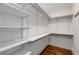 Walk-in closet with custom shelving and wood floor at 300 Massengale Rd, Brooks, GA 30205