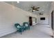 Relaxing covered patio with ceiling fans and seating, a great spot for outdoor entertaining at 300 Massengale Rd, Brooks, GA 30205