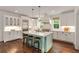 Modern kitchen with a large island, stainless steel appliances, and stylish cabinetry at 300 Massengale Rd, Brooks, GA 30205