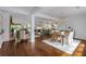 Open concept living spaces with hardwood floors, elegant dining area and modern kitchen at 300 Massengale Rd, Brooks, GA 30205
