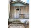 Close-up view of the front porch featuring decorative trim and steps leading to the entry door at 701 Garibaldi St, Atlanta, GA 30310