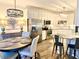 Well-lit kitchen featuring stainless appliances, a breakfast bar, and an adjacent dining area at 805 Doe Hill Ln, Roswell, GA 30075