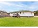 Exterior view of house featuring a large backyard at 118 Wheelan School Rd, Dallas, GA 30157