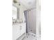 Updated bathroom featuring subway tile shower, modern vanity, and stylish hexagonal floor tiles at 118 Wheelan School Rd, Dallas, GA 30157