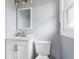 Bathroom with a single sink vanity, ample lighting and a toilet at 118 Wheelan School Rd, Dallas, GA 30157