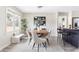Elegant dining room with a rustic table, modern chairs, and natural light at 118 Wheelan School Rd, Dallas, GA 30157