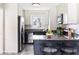Modern kitchen featuring stainless steel appliances, granite countertops, and stylish bar stools at 118 Wheelan School Rd, Dallas, GA 30157