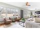 Open-concept living area with cozy seating, ceiling fan, and large windows at 118 Wheelan School Rd, Dallas, GA 30157